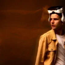 A man wearing a futuristic VR headset looking thoughtful, symbolizing the uncertainty and human reflection surrounding the AI bubble and technology trends in 2025.